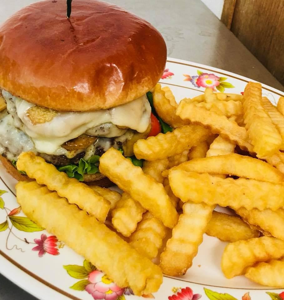 A cheeseburger with crinkle-cut fries