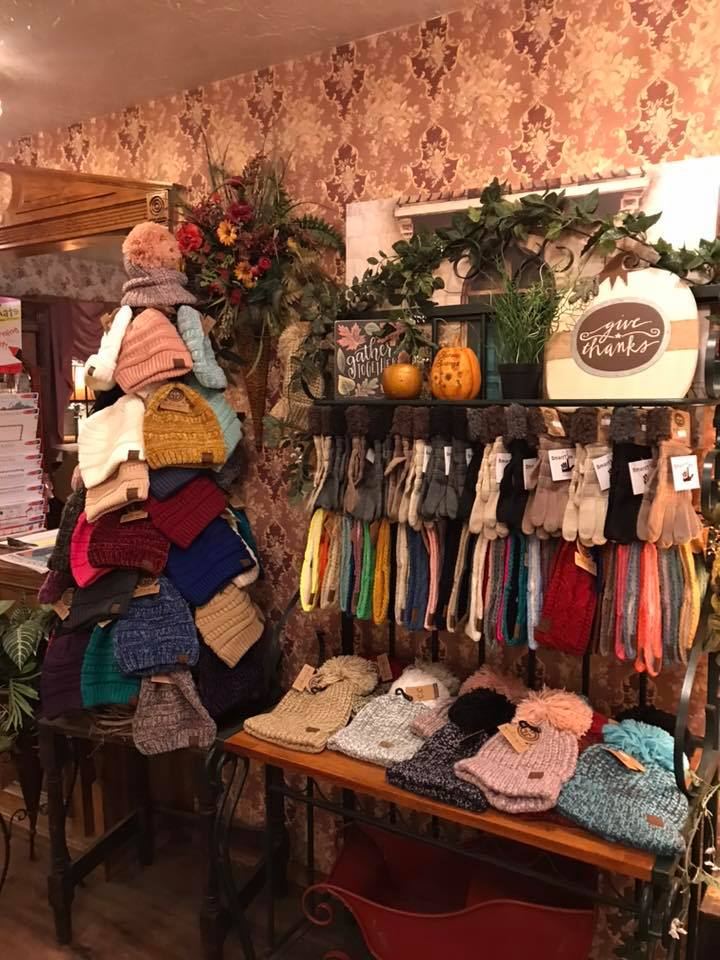 Knit hats, scarves and gloves on display in the gift shop